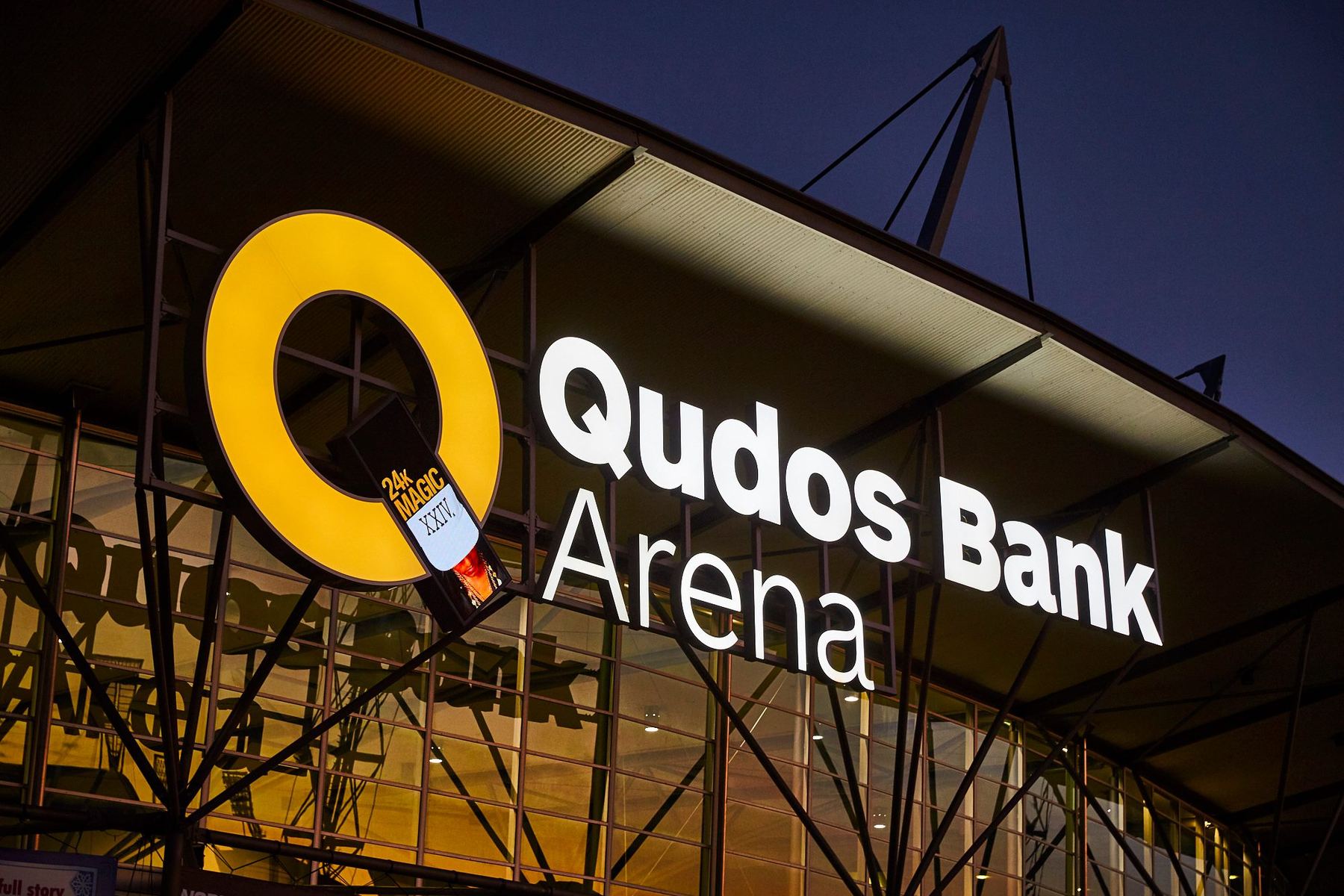 Qudos Bank Arena signage at dusk