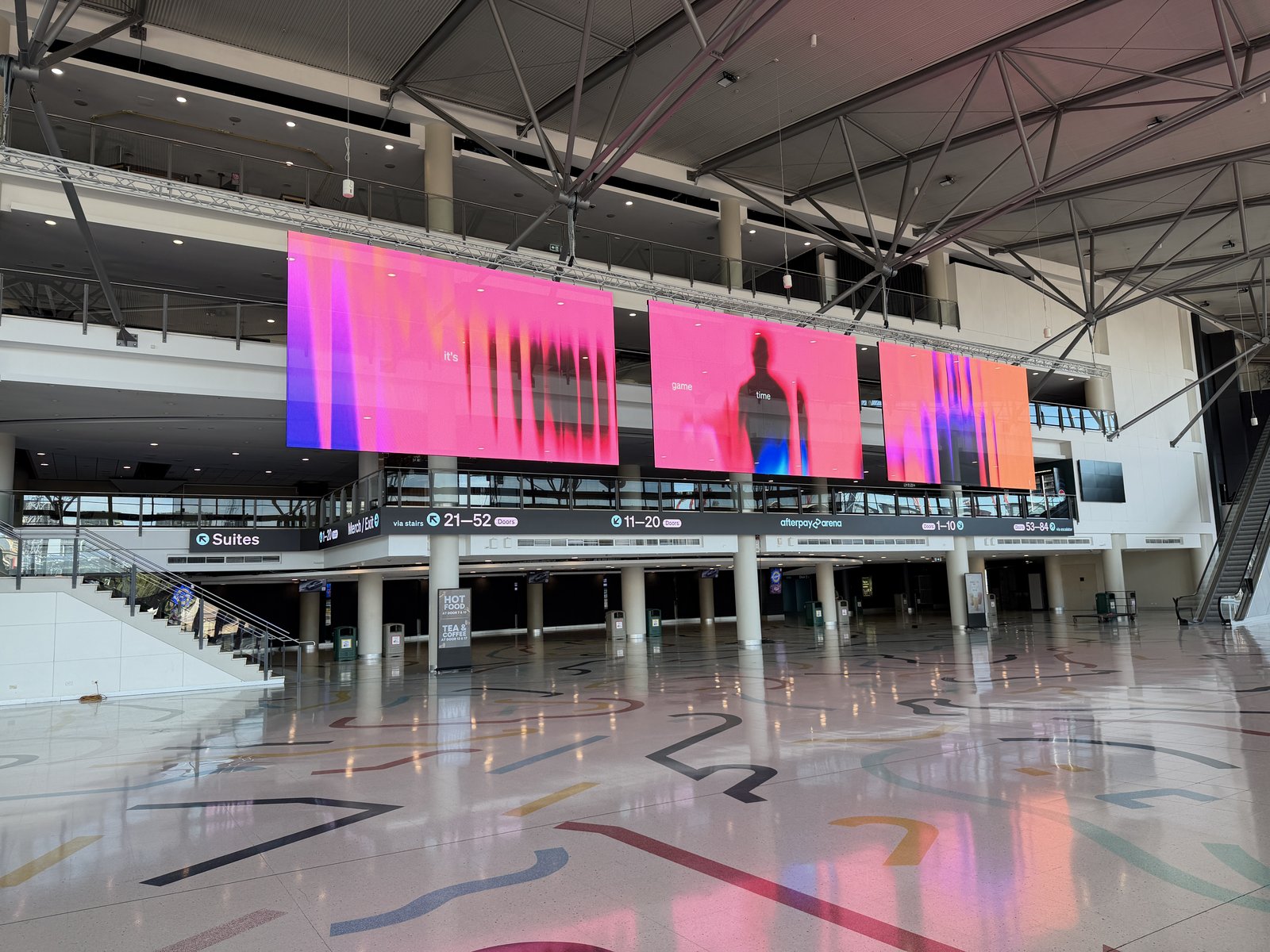 Transparent LED screens at Afterpay Arena showing live content